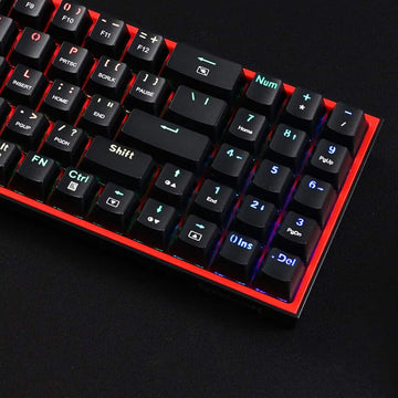 Detail view of the Redragon K628 Pollux RGB gaming keyboard's number pad area with illuminated keys