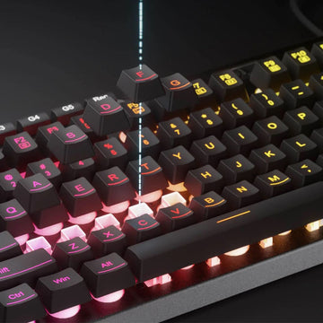 A close-up shot of the Redragon K513 RGB Gaming Keyboard, featuring black keys with vibrant, customizable backlighting