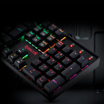Image focusing on the numeric pad of the Redragon K551 MITRA RGB full-size mechanical keyboard with illuminated keys.