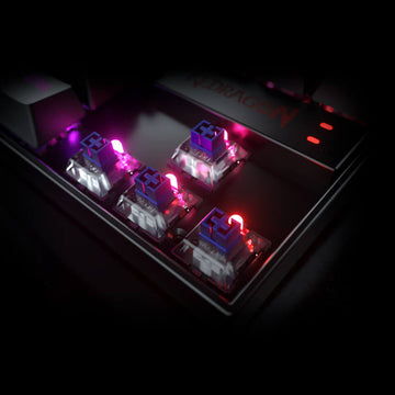 Redragon K552 Black Kumara RGB gaming keyboard close-up showing Outemu Blue switches