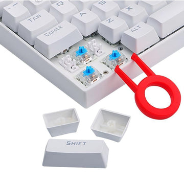 Close-up of a white Redragon Kumara K552 TKL mechanical keyboard showing blue Outemu switches, with keycaps removed & a red puller