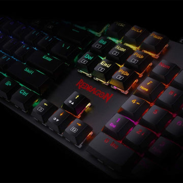Close-up view of Redragon K589 Shrapnel RGB Mechanical Gaming Keyboard, highlighting texture of several keycaps & RGB lighting 