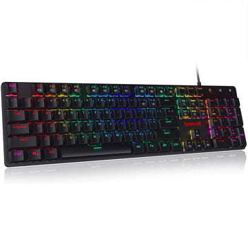 Redragon K589 Shrapnel keyboard, emphasizing its low-profile base, the ergonomic keycap arrangement & the glow from its RGB backlit
