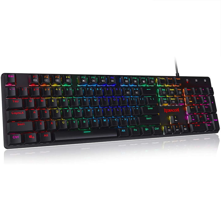 Redragon K589 Shrapnel keyboard, emphasizing its low-profile base, the ergonomic keycap arrangement & the glow from its RGB backlit