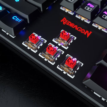 Red mechanical switches of Redragon K589 keyboard, highlighting their linear design for a smooth, quiet typing, along with RGB