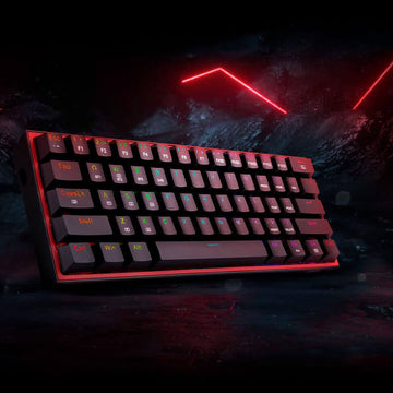 Redragon K616 RGB Fizz Pro gaming keyboard illuminated with colorful RGB light, presented at an angle on a dark surface