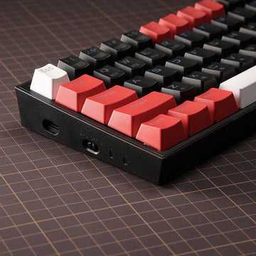 Stylish Redragon K631 Castor PRO keyboard with vibrant red and black keycaps, designed for gamers seeking a unique aesthetic