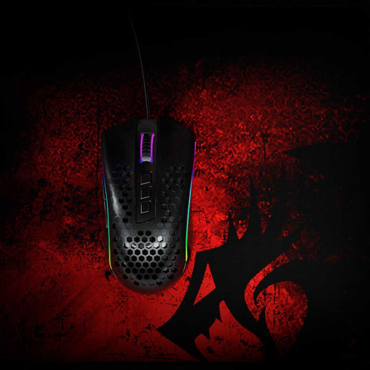 Gaming mouse with RGB lighting on a red and black textured background