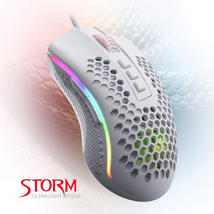Gray gaming mouse with RGB lighting on a white background, featuring the brand 'STORM'.