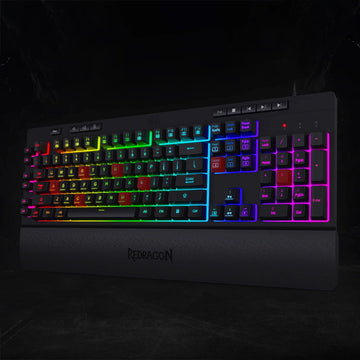 Redragon K512 RGB membrane keyboard with advanced anti-ghosting, shown with multiple illuminated keys active for competitive gaming