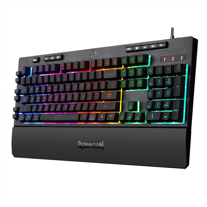 Redragon K512 Shiva RGB membrane gaming keyboard in black, shown from the right side with full layout and attached ergonomic wrist rest